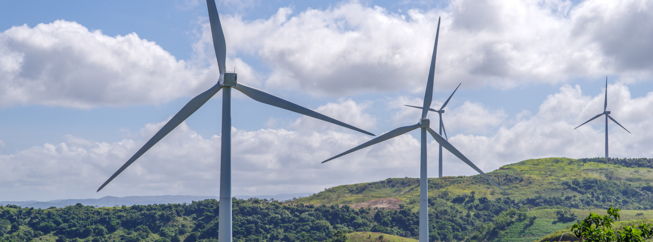 Four wind turbines set in the hills